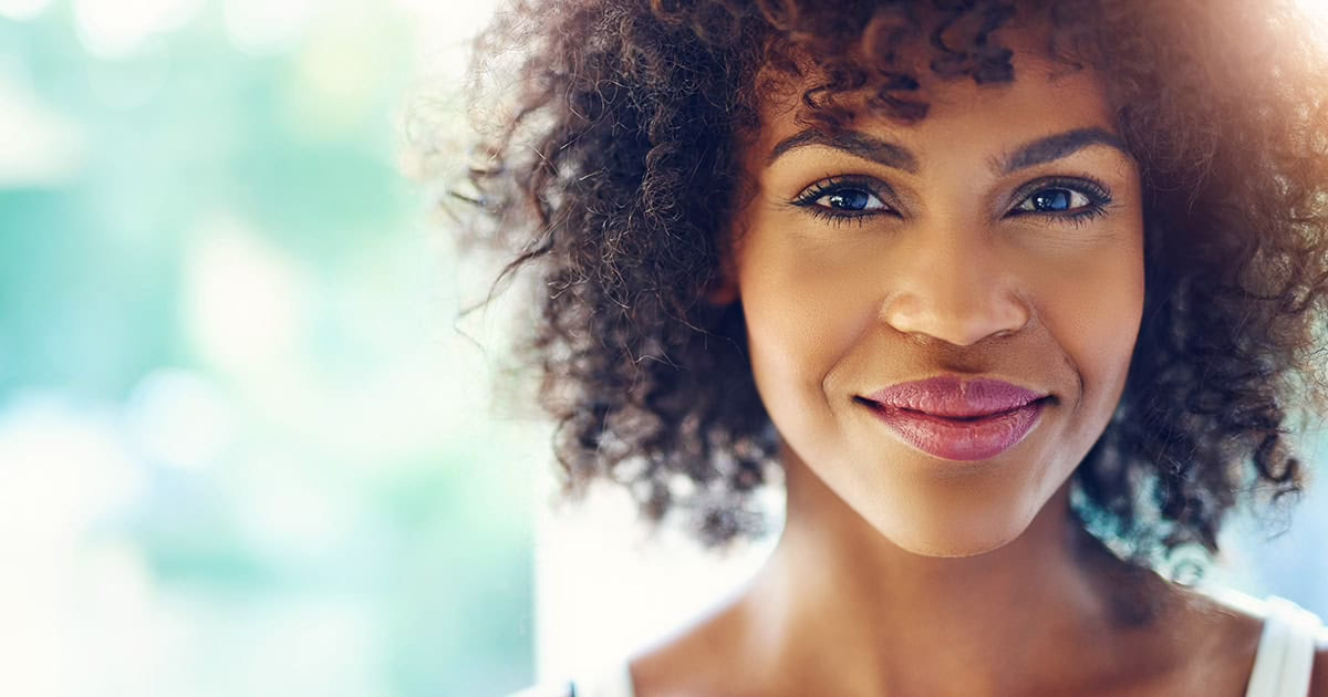 black-woman-smiling-at-camera Black woman smiling at camera