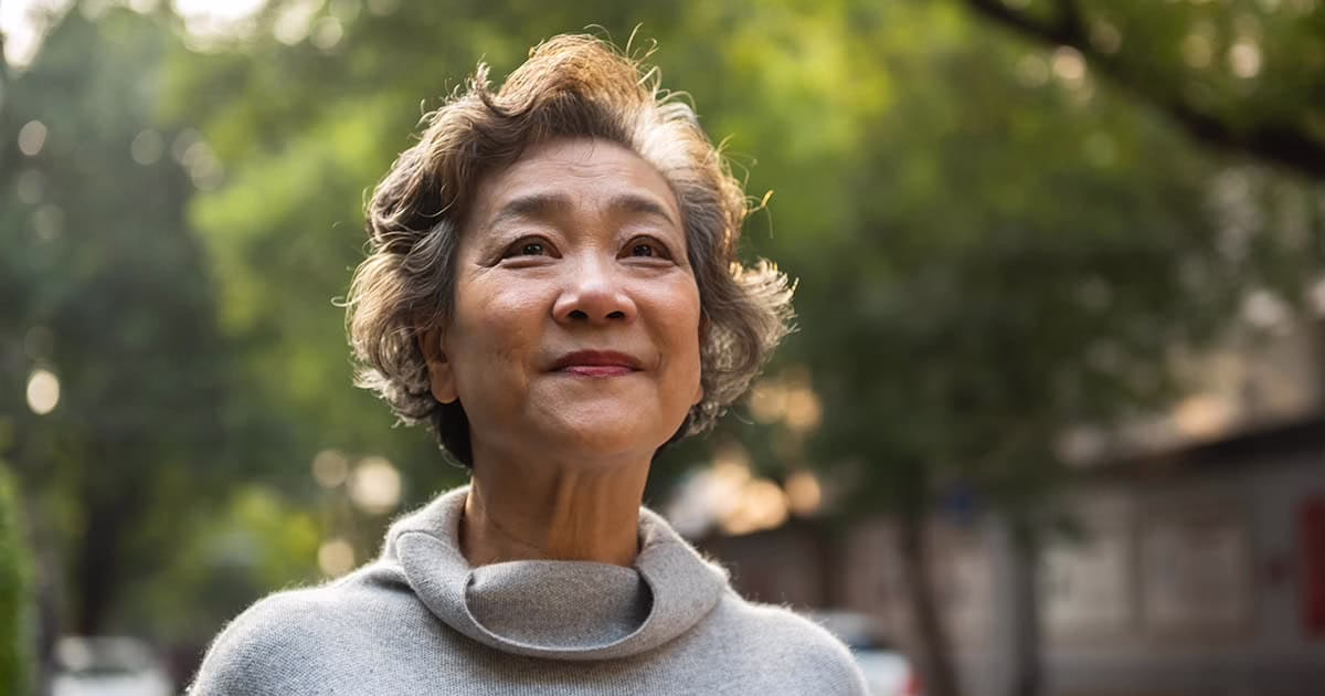 Asian Older Short Haired Woman Hopeful 1200w Older short-haired Asian woman looking hopeful