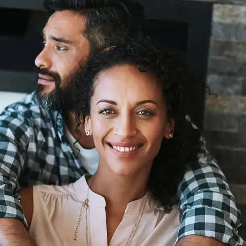 couple embracing and smiling