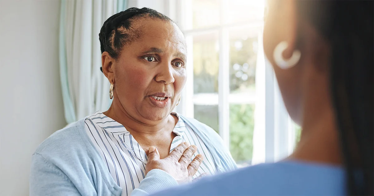 older woman speaking with doctor Confident young woman looking at camera
